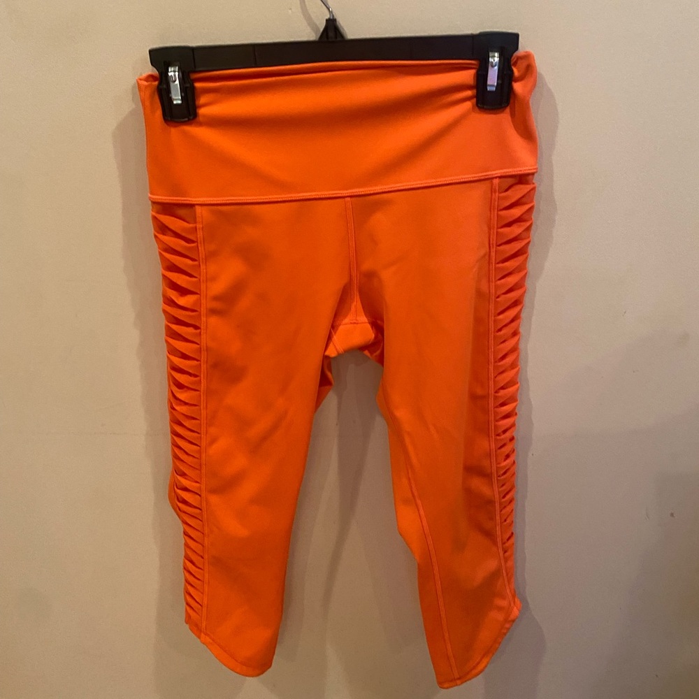 Neon orange lattice mesh leggings